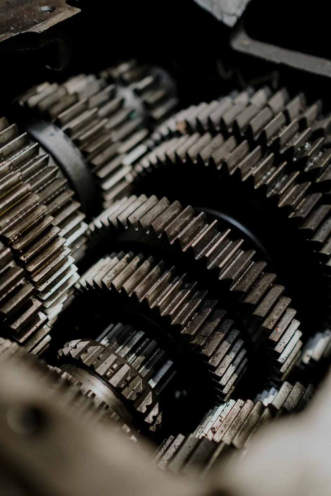 Close-up of interlocking metal transmission gears inside a machine.